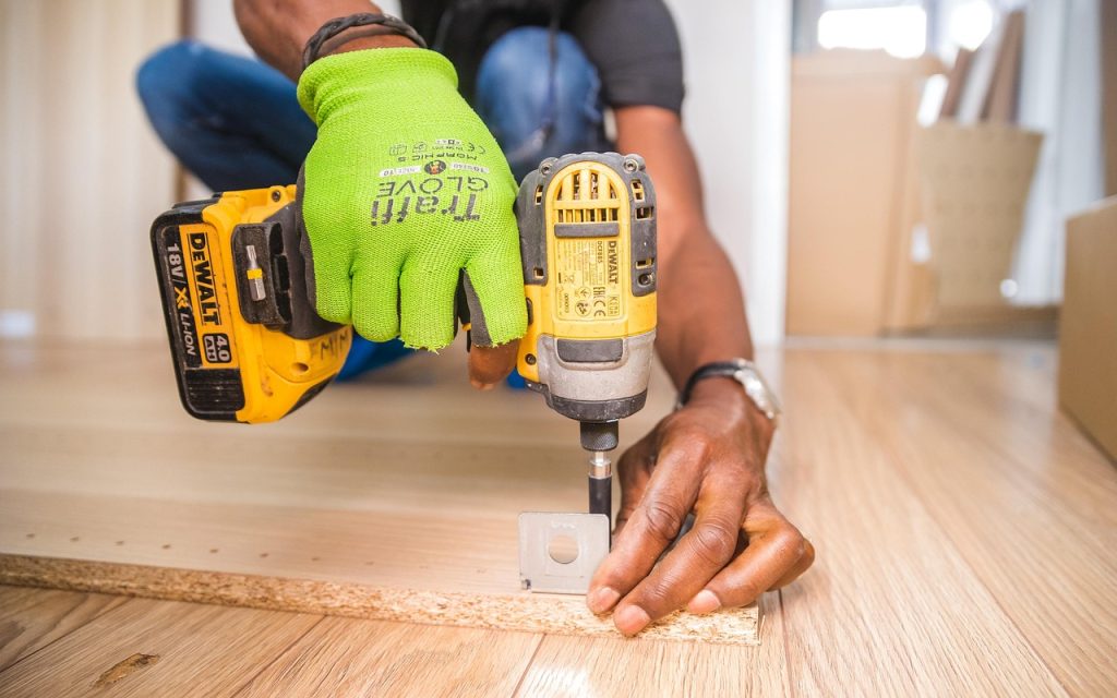Handyman, furniture assembly, drill — Stay Cool with Routine Air Conditioning Service in Las Vegas