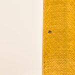 close-up of a cylindrical object with a decorative pattern and a small hole